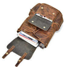 Load image into Gallery viewer, The Hagen Backpack | Vintage Leather Backpack with open compartments showing books and gadgets, made of soft durable cowhide leather.
