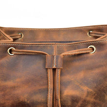 Load image into Gallery viewer, Close-up of The Hagen Backpack&#39;s vintage leather texture with natural creases and durable design.
