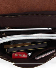 Load image into Gallery viewer, Inside view of The Gyda Backpack | Vintage Leather Travel Backpack with books, gadgets, and notes securely stored.
