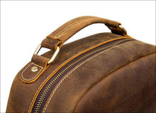 Load image into Gallery viewer, Close-up of The Langley Backpack | Genuine Vintage Leather Backpack featuring durable crazy horse leather and detailed stitching.
