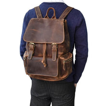Load image into Gallery viewer, The Hagen Backpack | Vintage Leather Backpack on person&#39;s back, featuring genuine cowhide leather, versatile design, durable and stylish.
