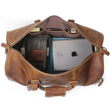 Load image into Gallery viewer, Open view of The Dagny Weekender | Large Leather Duffle Bag showcasing spacious interior with multiple pockets and essentials packed inside.
