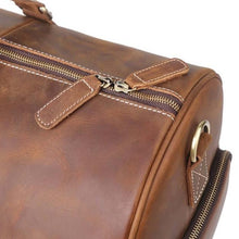 Load image into Gallery viewer, Close-up of The Dagny Weekender | Large Leather Duffle Bag showcasing durable full-grain leather and sturdy zippers.
