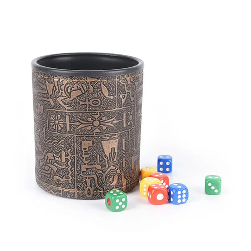 Egyptian pattern brown leather rune dice cup with colorful dice for gaming or divination rituals.