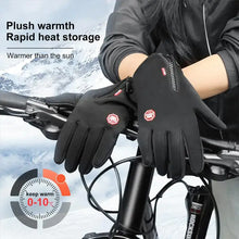 Load image into Gallery viewer, Person wearing thermal waterproof gloves gripping bicycle handlebars in snowy weather, showcasing warmth and durability for outdoor activities.
