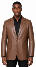 Charger l'image dans la galerie, A man modeling a brown real-leather blazer over a black collared shirt and black pants, shot against a plain white background.
