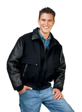 Load image into Gallery viewer, Man wearing a REED leather varsity bomber jacket with black leather sleeves, showcasing a classic and stylish USA-made design.
