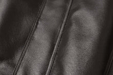 Load image into Gallery viewer, Close-up of REED Men&#39;s genuine leather jacket featuring a sleek, luxurious surface with a classic American bomber design.
