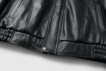 Load image into Gallery viewer, Close-up of REED Men&#39;s Bomber Genuine Leather Jacket showcasing sleek black leather texture and stylish design.
