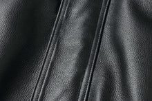 Load image into Gallery viewer, Close-up of genuine leather texture on a REED men&#39;s American style bomber jacket.
