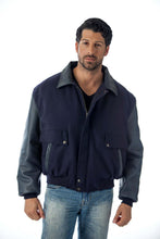Load image into Gallery viewer, Men&#39;s leather varsity bomber jacket with wool body and leather sleeves, made in USA, worn by model with blue jeans.
