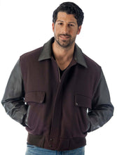Load image into Gallery viewer, Men&#39;s leather varsity bomber jacket with wool body and leather sleeves, modeled by a man. Made in USA, classic and stylish design.
