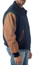 Load image into Gallery viewer, REED Men&#39;s premium blue leather letterman varsity jacket made in USA, shown on model, showcasing stylish design and quality craftsmanship.
