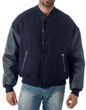 Load image into Gallery viewer, Alt Tag: REED Men&#39;s Premium Varsity Jacket, leather and wool, crafted in USA, classic style, quilted lining, shown on model.

