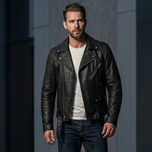 Load image into Gallery viewer, Man wearing a black leather jacket and dark jeans standing in an urban setting.
