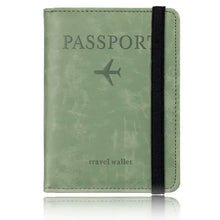 Load image into Gallery viewer, Green leather blocking passport holder with RFID protection and black elastic band.
