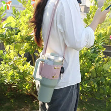 Load image into Gallery viewer, Woman using PU leather coffee cup carrier with shoulder strap outdoors

