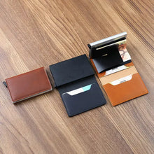 Load image into Gallery viewer, Vegan leather credit card holders with RFID blocking, displayed on a wooden surface for stylish and secure card storage.
