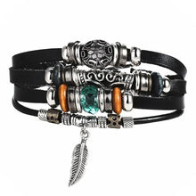 Load image into Gallery viewer, Multilayer leather bracelet with silver and turquoise accents and feather charm, enhancing style and elegance.
