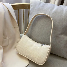 Load image into Gallery viewer, Crocodile pattern PU leather women&#39;s shoulder bag on a chair, stylish and perfect for all occasions, featuring convenient zipper.
