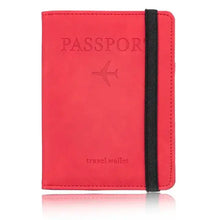 Load image into Gallery viewer, Red leather blocking passport holder with RFID protection and black elastic band for secure travel organization.
