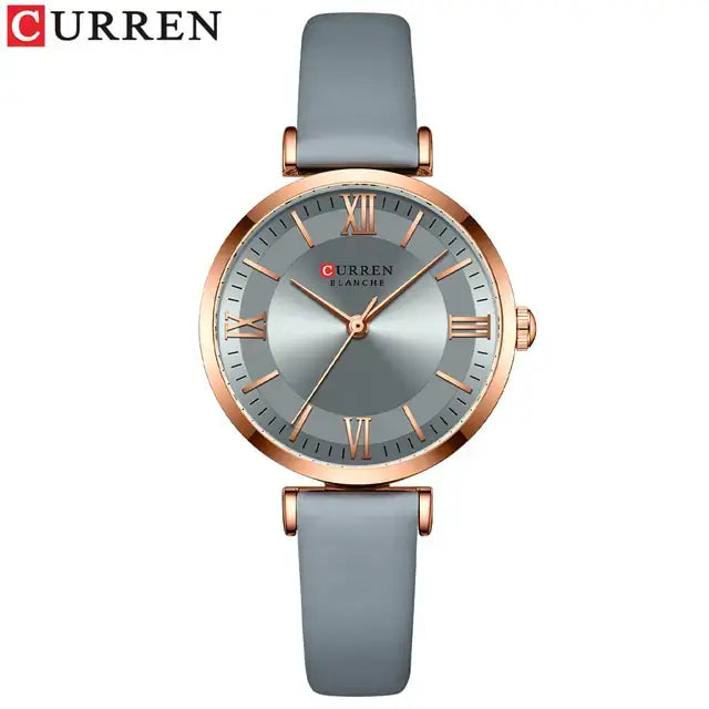 Classic Clock Leather Watch for women with elegant grey leather strap and gold-tone clockface, featuring water-resistant quartz movement.