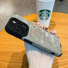 Load image into Gallery viewer, Person holding Luxury Leather Sneaker Phone Case in Starbucks, showcasing sleek design and high-quality protection for iPhone.
