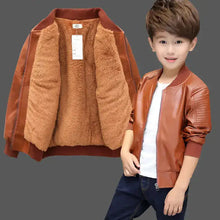 Cargar imagen en el visor de la galería, Boy wearing vegan leather and fur jacket, brown color, showcasing style and warmth, perfect winter wear.

