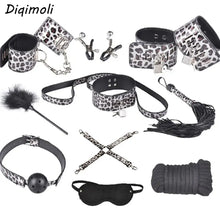 Cargar imagen en el visor de la galería, 10-piece vegan leather bondage set featuring cuffs, collar, whip, blindfold, and more in leopard print design for BDSM play.
