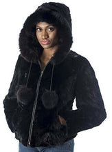 Load image into Gallery viewer, Woman wearing a REED women&#39;s genuine mink fur bomber jacket with hood, showcasing luxurious black mink fur design.
