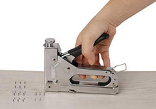 Load image into Gallery viewer, eZthings 3-in-1 staple gun in use on wood with 2400 staples, ideal for carpentry, upholstery, and more heavy-duty projects.
