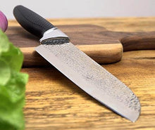 Load image into Gallery viewer, eZthings 12&quot; Chef&#39;s Knife with a razor-sharp, stain-resistant blade and ergonomic black handle on a wooden cutting board.
