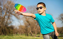 Load image into Gallery viewer, Child playing with eZthings heavy duty stress relief fidget toy in park
