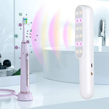 Load image into Gallery viewer, eZthings Professional UV Sterilizer travel-size wand sanitizing a bathroom environment effectively, showcasing its chemical-free cleaning.
