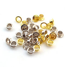 Load image into Gallery viewer, Assorted gold and silver metal grommets for leather crafting projects
