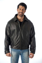 Load image into Gallery viewer, Model wearing REED Men&#39;s All American Bomber Leather Jacket, union made in USA, classic bomber style in black leather.
